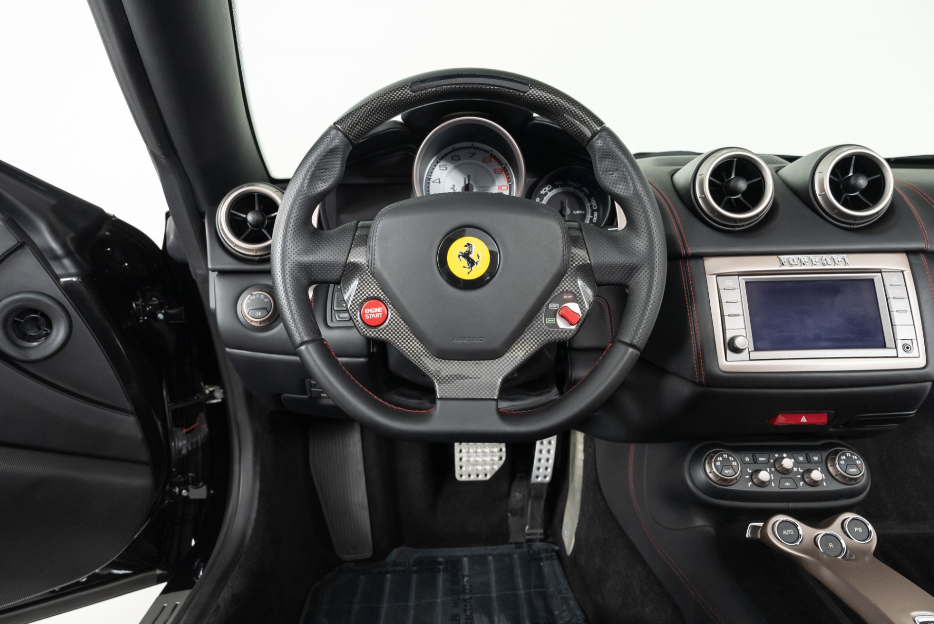 A close up of a car dashboard photo – Free Ferrari Image on